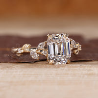 Nature inspired engagement ring with emerald old european cut diamond setting.
