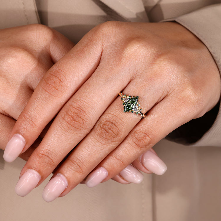 Lab grown diamond ring with green marquise center stone.
