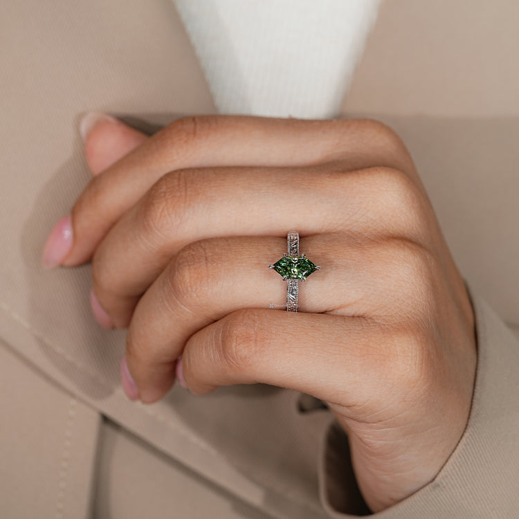 Dutch marquise diamond ring with six leaf style prongs.