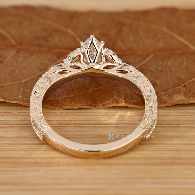 Lab grown diamond with marquise side stones and Art Deco.