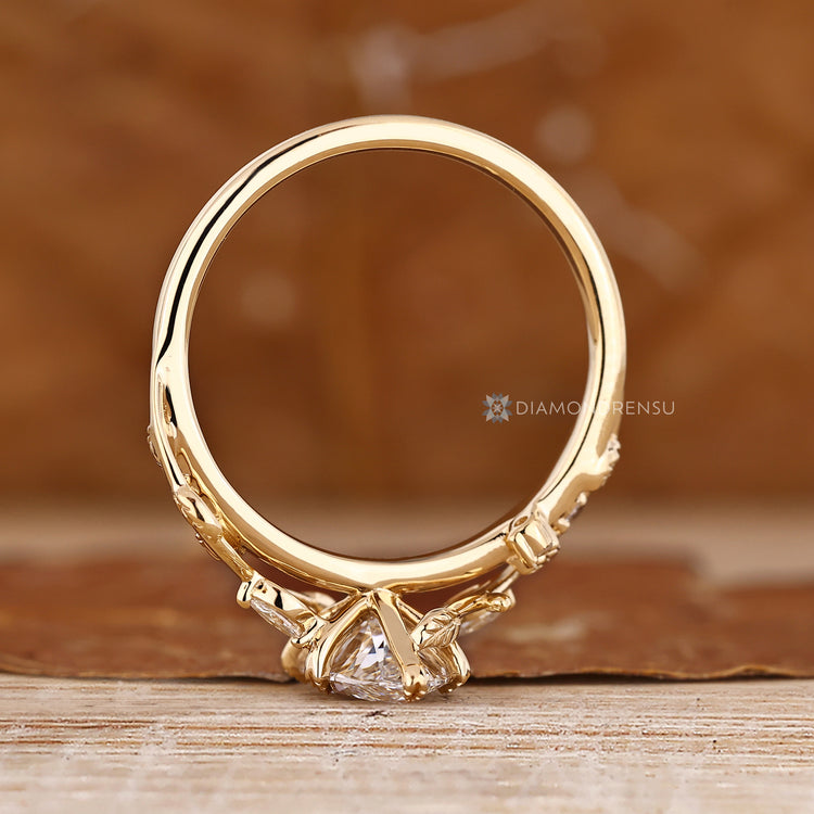 Marquise diamond ring with six leaf style prongs and cathedral setting.