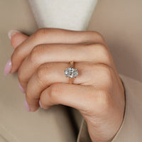 Bridge accent with round stone paired with four claw prong setting.