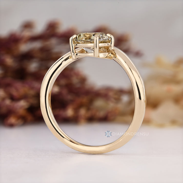Diamondrensu presents a light yellow cushion old mine cut ring.