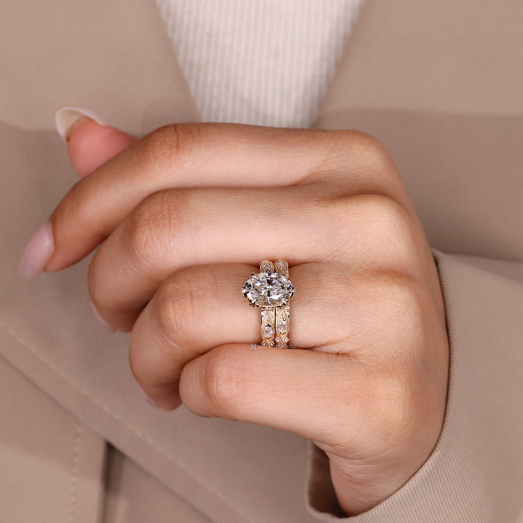Four claw prong setting on an oval bridal set with vintage style.