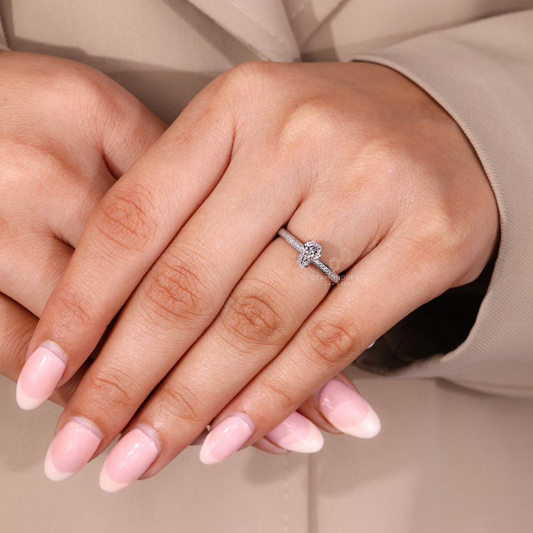 Coffin cut diamond ring with cathedral setting and prong details.