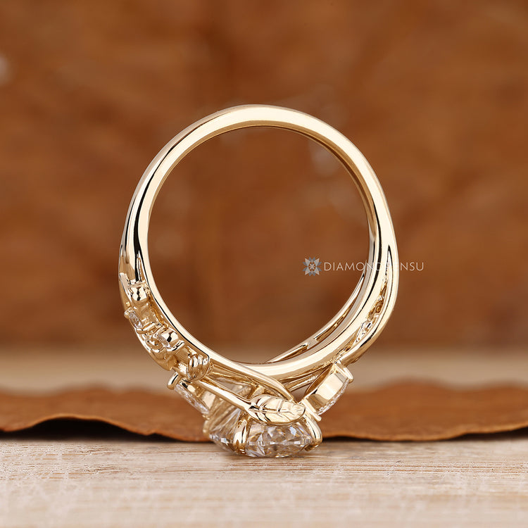 Handmade engagement ring with an oval center stone.