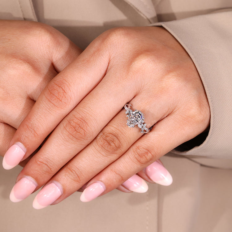 Lab grown diamond ring with coffin center and side stone accents.