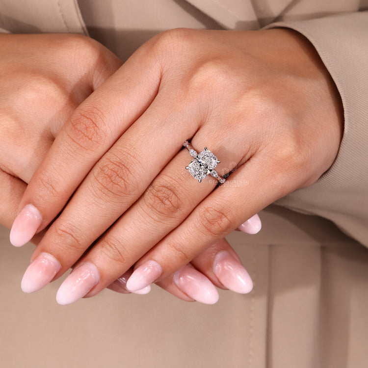 Lab grown elongated cushion cut diamond ring with hidden halo design.