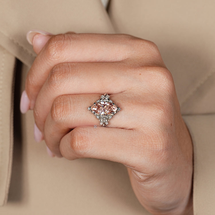Vintage pink marquise diamond ring with cluster setting.