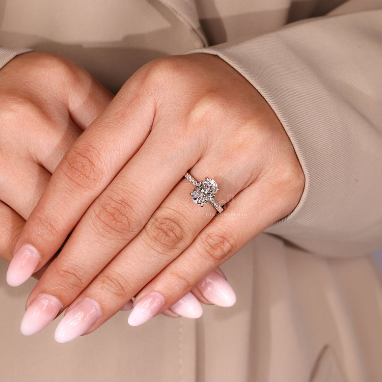 Lab grown diamond oval cut ring with pave band and hidden accents.