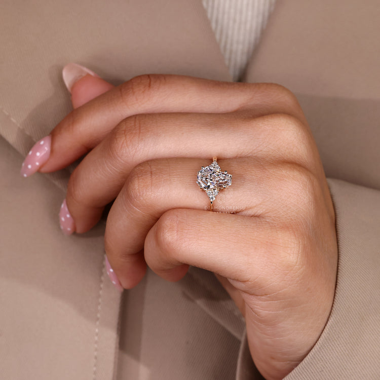Seven stone engagement ring with coffin cut center diamond.