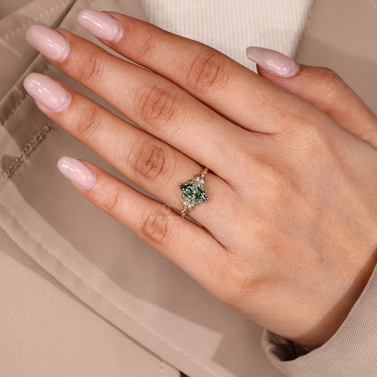 Vintage style engagement ring with trillion side stones and cluster design.