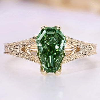 Green coffin cut diamond ring.
