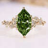 Nature inspired diamond ring with a green Dutch marquise.