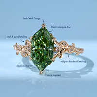 Green Dutch marquise diamond ring with milgrain details.