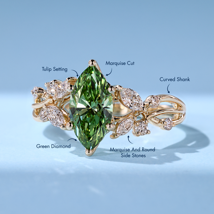 Green marquise diamond ring with marquise side stones.