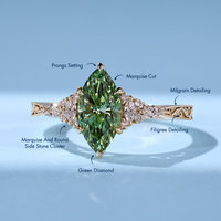 Green marquise diamond ring with a tulip setting.