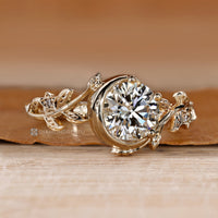 Half bezel ring with round center diamond.