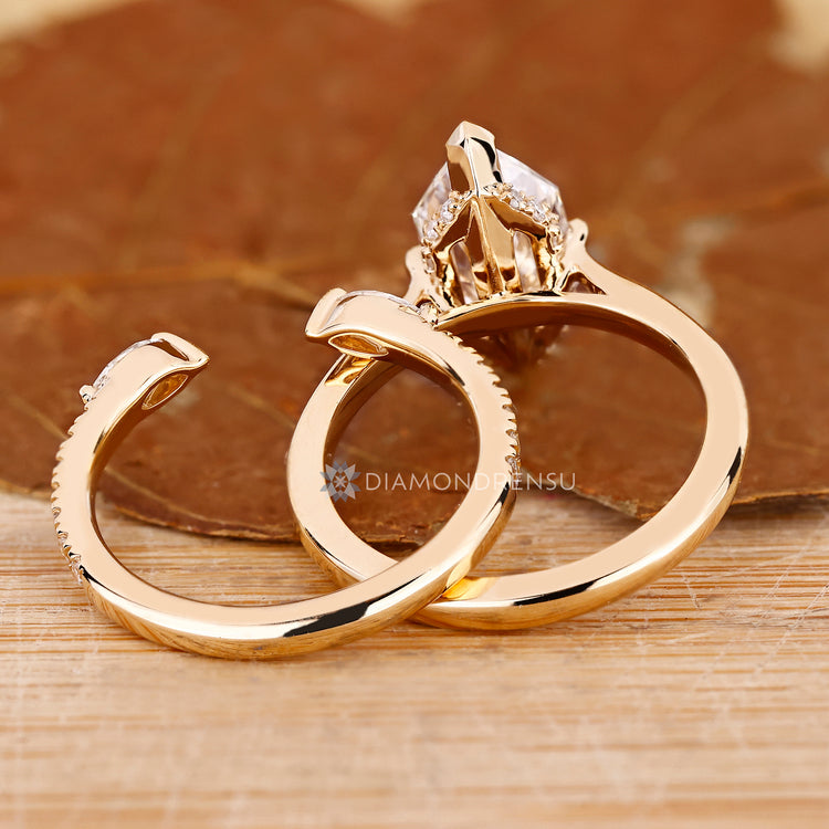 Half eternity style enhances this Dutch marquise wedding ring.