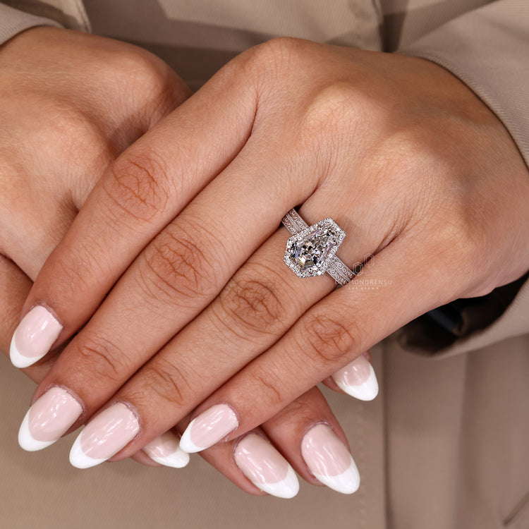 Handmade coffin cut ring with vintage style and round cut halo.