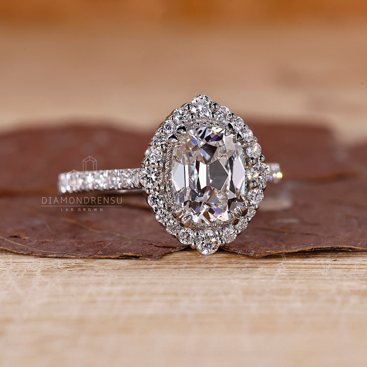 Cushion old mine cut center stone with cathedral style band.
