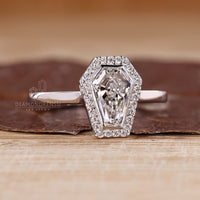 IGI certified coffin cut diamond ring with bezel setting.