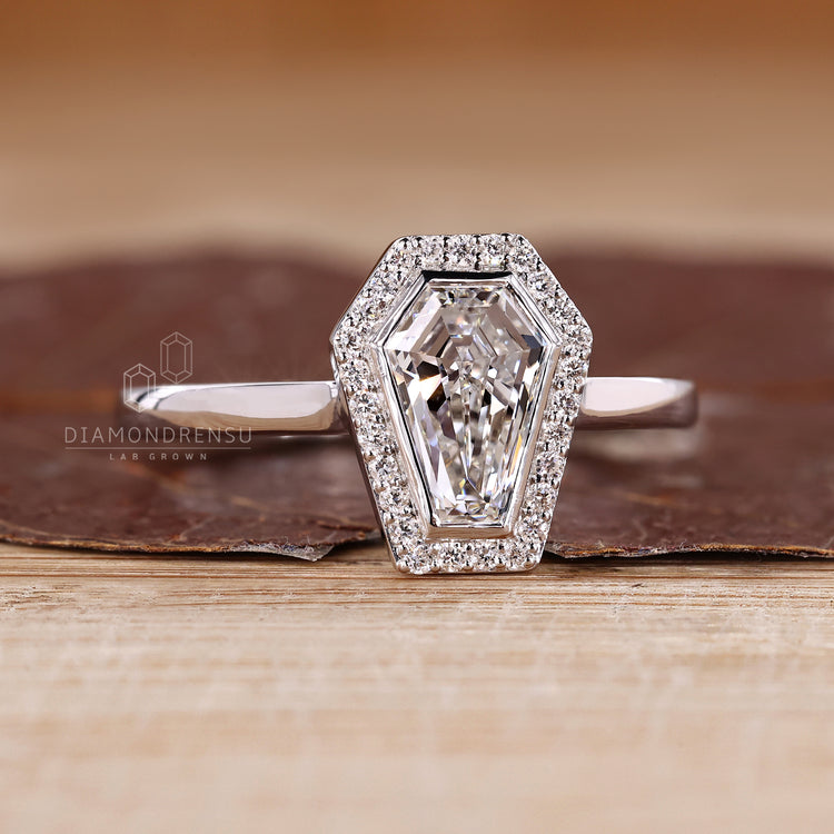 IGI certified coffin cut diamond ring with bezel setting.