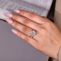 Pear cut engagement ring with six claw prong setting.
