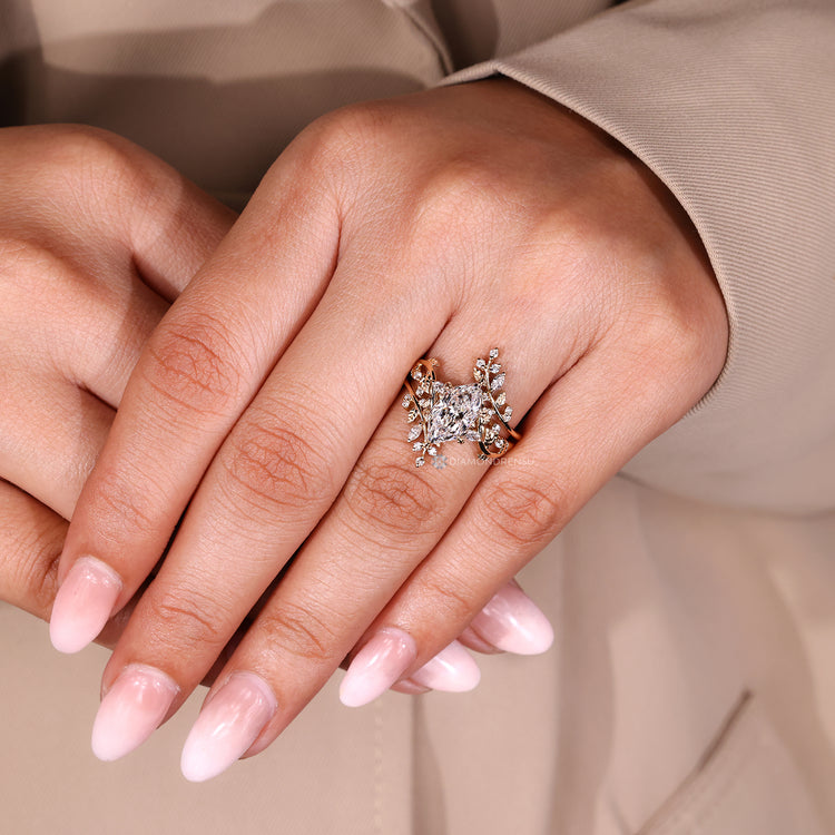 Diamondrensu presents a nature inspired ring with marquise and round side stones.