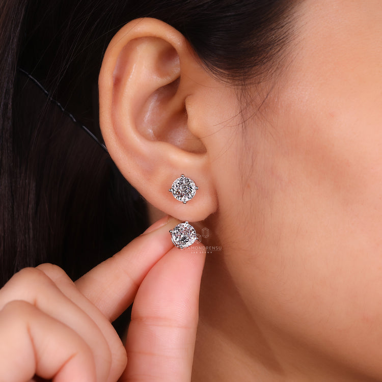 Portuguese cut diamond stud earrings with secure screw backs.