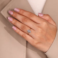 Cathedral setting three stone marquise and pear ring.