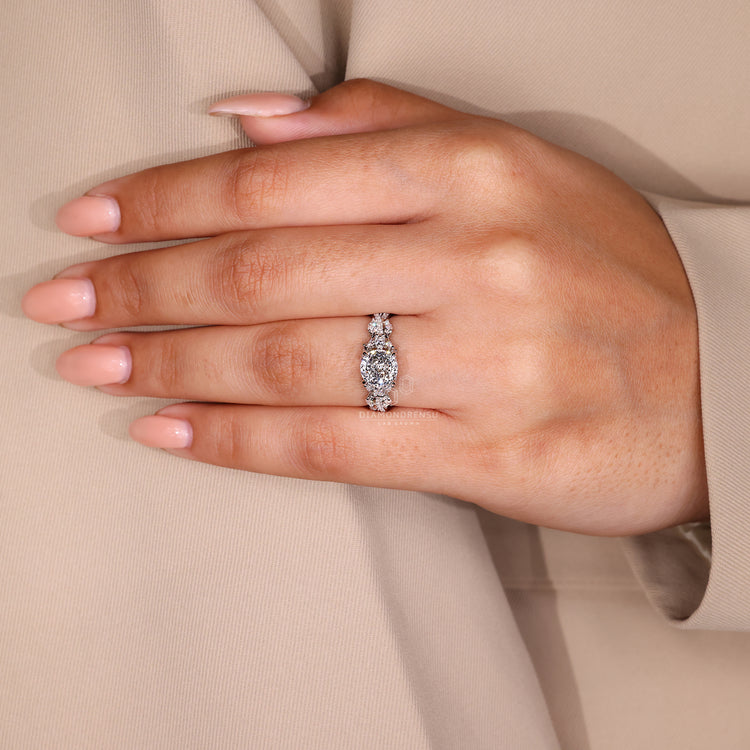 Handmade ring with a Portuguese cut diamond and side stones.