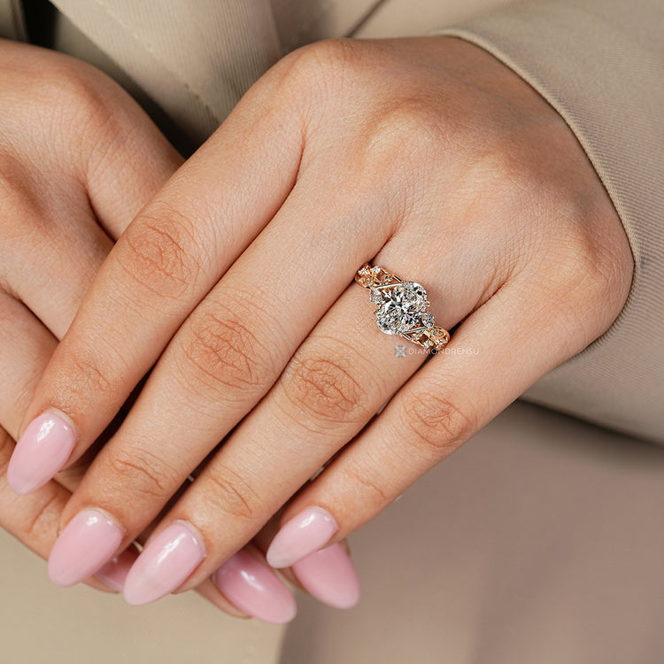 Oval center stone complements the four leaf style prong setting.