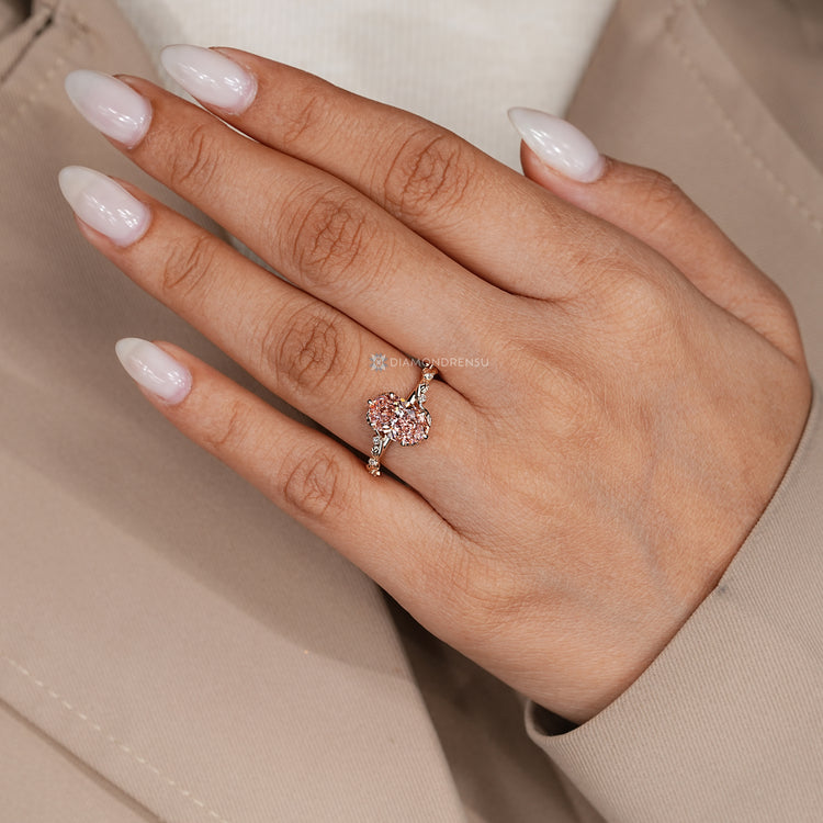Oval lab grown diamond ring with round side stones.