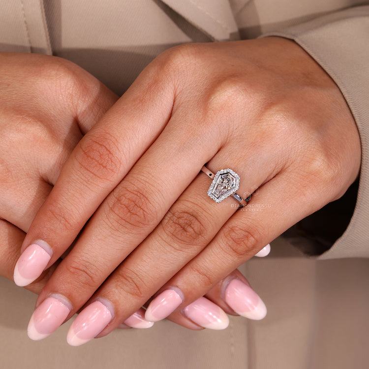 Lab grown diamond ring with coffin center and round halo accents.