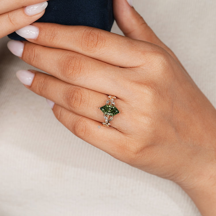 Green Dutch marquise engagement ring with round side stones.
