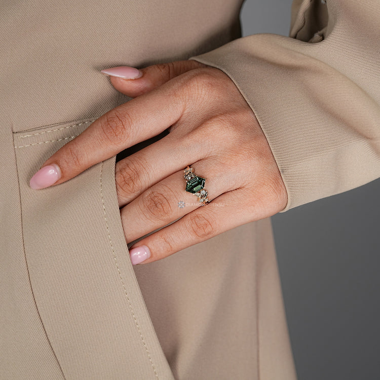 IGI certified lab grown diamond complements the round side stones.