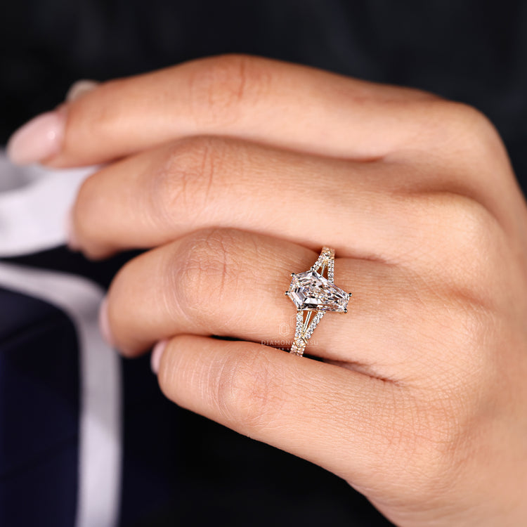 Handmade coffin engagement ring with cathedral setting.