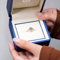 IGI certified oval diamond ring with tapered shank.