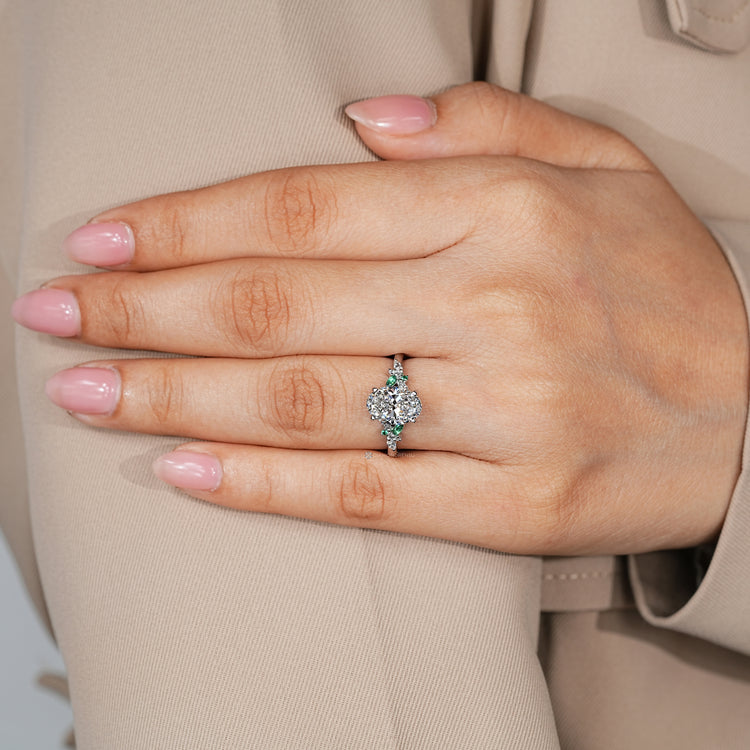 Handmade oval diamond ring with green emerald side stones by Diamondrensu.