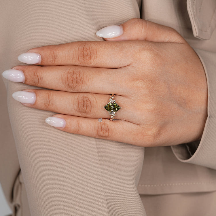 Nature inspired diamond ring with a six leaf style prong setting.