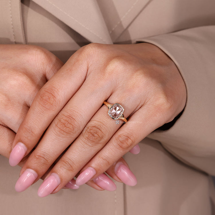 Lab grown cushion rose cut ring with bezel setting and tapered band.
