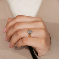Handmade oval cut diamond ring with baguette accents.