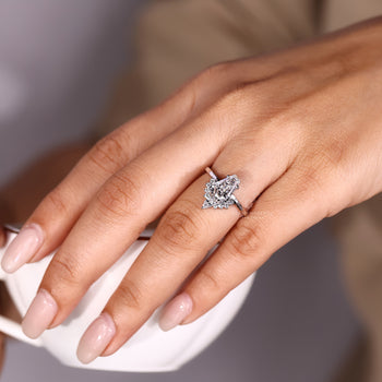 Handmade coffin engagement ring with four prong setting.