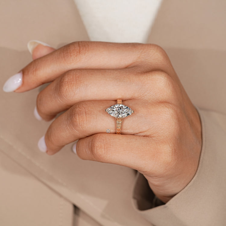 Marquise ring with a cathedral setting.