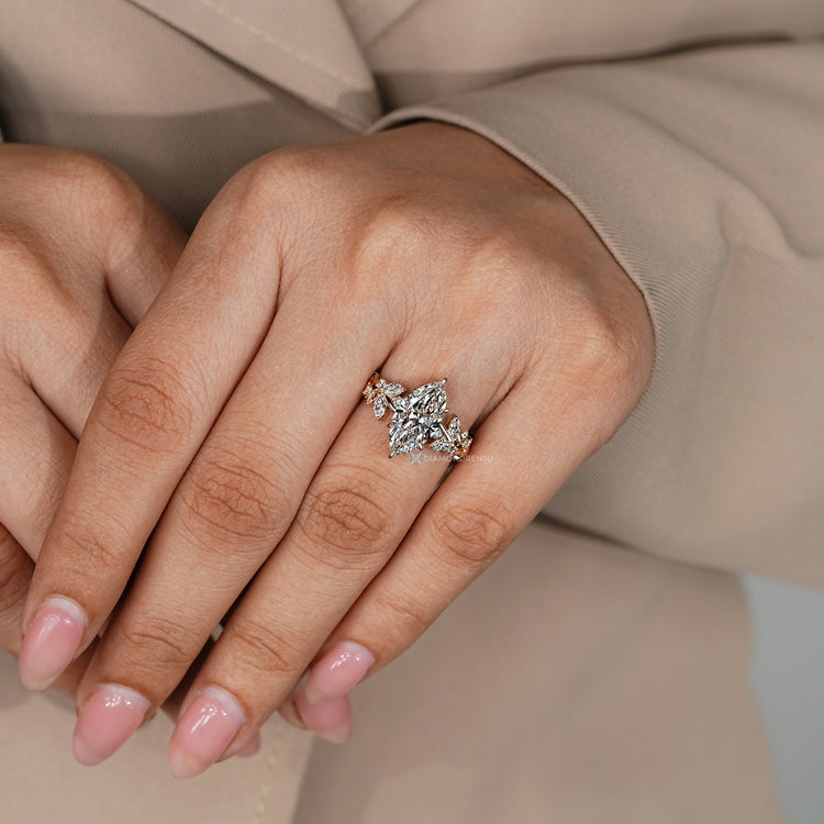 Marquise engagement ring with round and marquise side stones.