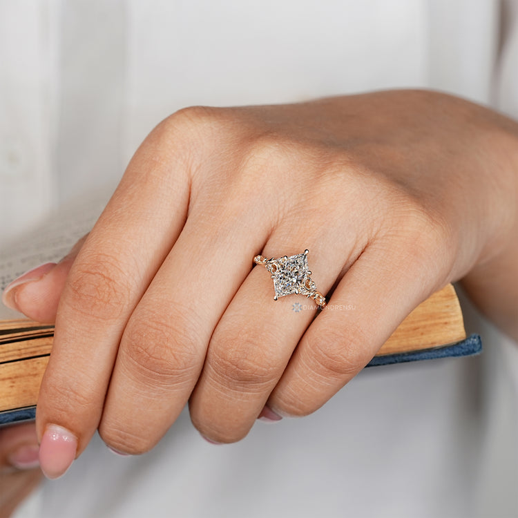Nature inspired Dutch marquise ring with round diamond side stones.