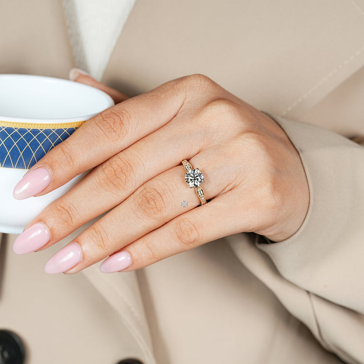 Art deco round cut diamond ring with hidden diamonds.