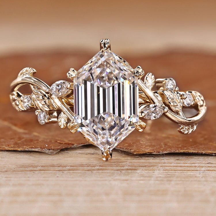 Nature inspired diamond ring with hexagon center stone and side stones.