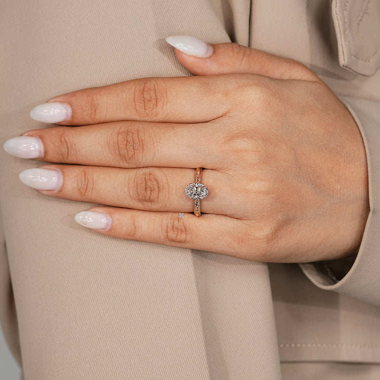 Lab grown diamond oval ring with a four claw prong setting.
